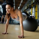 Fit girl workout with fitness ball in gym. Sport helath fitness lifestyle concept